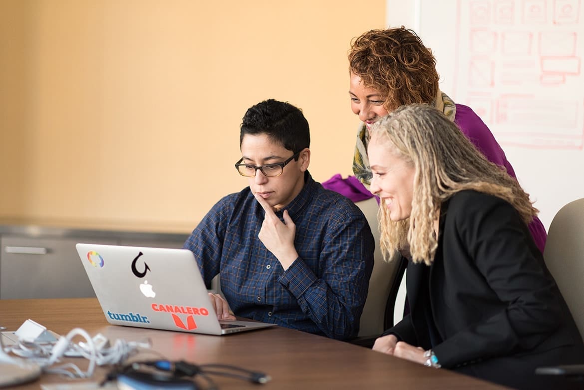 Teachers engaged in a productive meeting using LoopSpire's Meeting Management module for effective school check-ins.